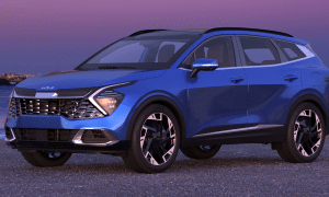 A blue SUV parked on gravel with a twilight sky background.