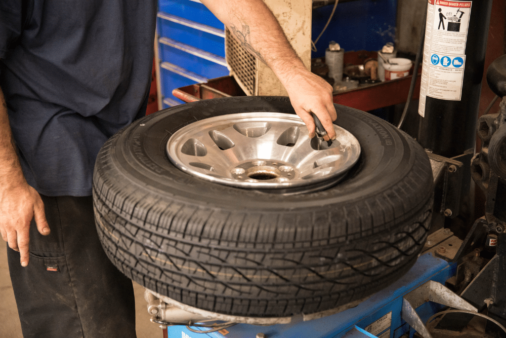Spring Car Maintenance in Chicopee MA At E&G Automotive. Close-up of car tire during routine maintenance service